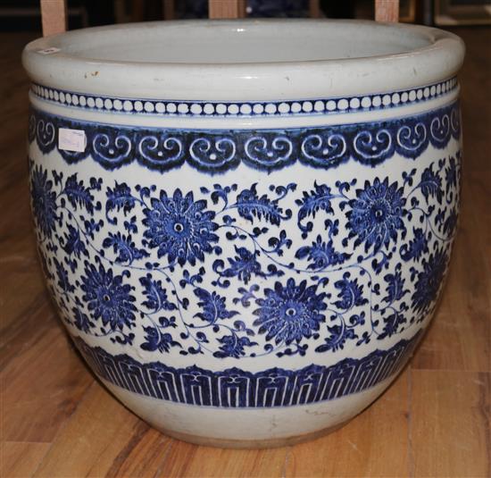 A large Chinese blue and white fish bowl, cracked, diameter 58cms